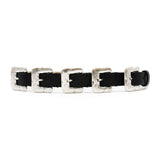 Black Italian leather belt with sculptural silver-plated multi-buckle detailing, handcrafted in Los Angeles using custom hardware