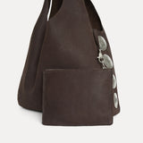 Close-up of the Rhea Slouchy Hobo in coffee nubuck Italian leather with detachable zip pouch and silver hardware - Streets Ahead