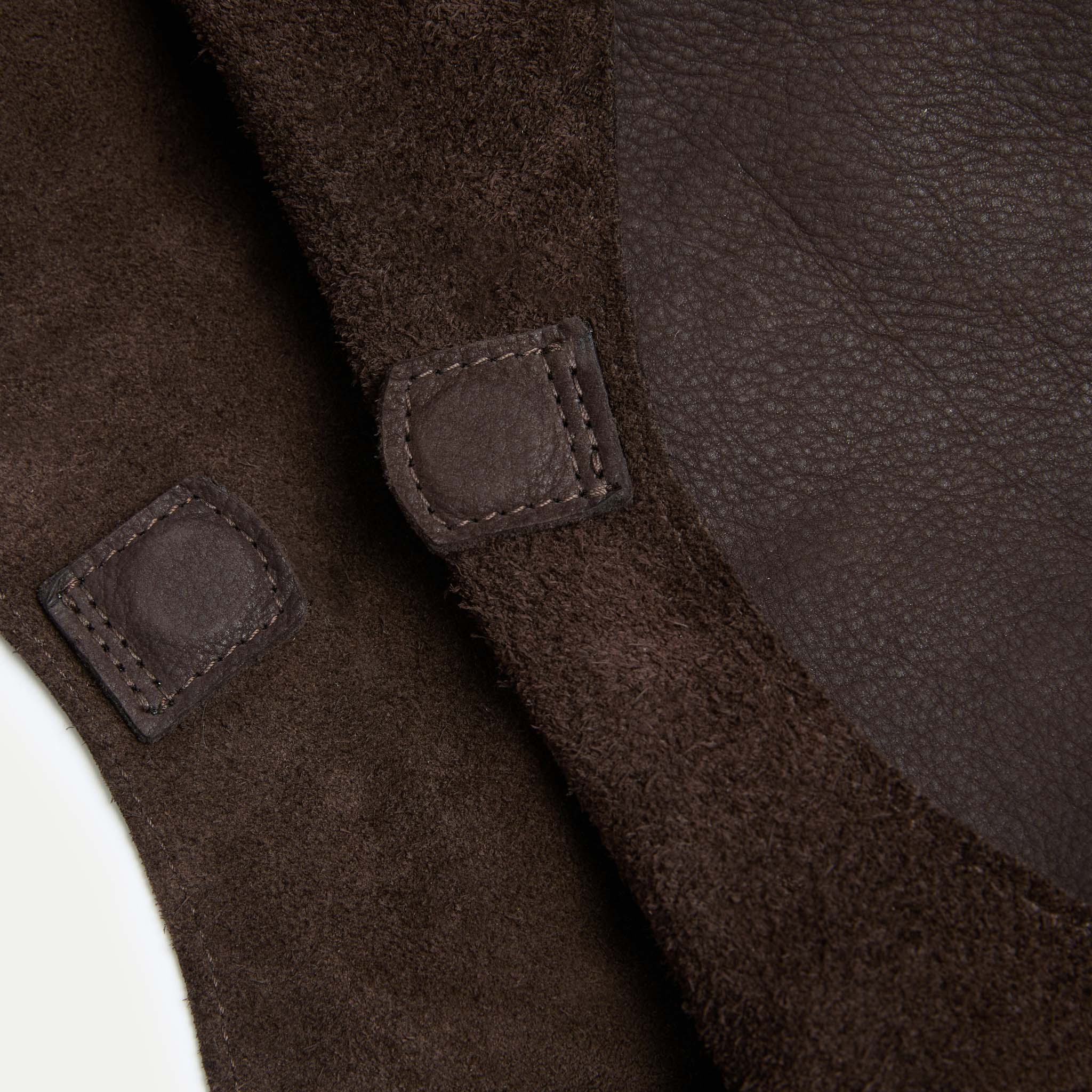 Interior detail of the Rhea Slouchy Hobo in black suede and leather showing reinforced magnetic closure - Streets Ahead