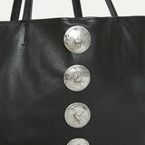 Close-up of silver Italian hardware detail on the Gaia Slouchy Tote in black leather.
