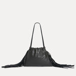 Front view of the Diana Fringe Bag in black leather with drawstring closure and side fringe - Streets Ahead