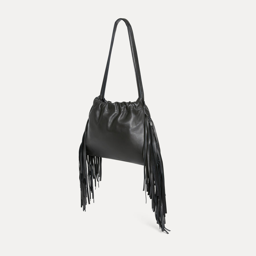 Angled view of the Diana Fringe Bag in black leather with soft silhouette and fringe trim - Streets Ahead