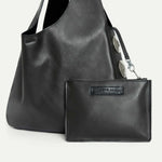 Close-up of the Rhea Slouchy Hobo in black Italian leather with detachable zip pouch and silver hardware - Streets Ahead