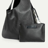 Close-up of the Rhea Slouchy Hobo in black Italian leather with detachable zip pouch and silver hardware - Streets Ahead