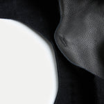 the Rhea Slouchy Hobo in black leather showing reinforced snap closure stitching - Streets Ahead