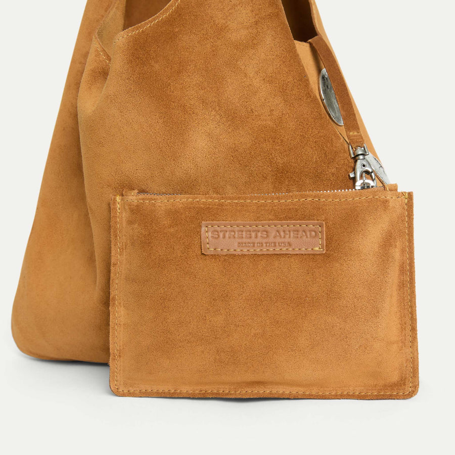 Close-up of the Rhea Slouchy Hobo in tan suede leather with detachable zip pouch and silver hardware - Streets Ahead