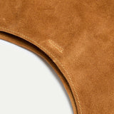 exterior detail of the Rhea Slouchy Hobo in tan suede and leather showing reinforced snap closure stitching - Streets Ahead