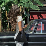 Mila Mini - Handheld Mini Black Textured Handbag - Streets Ahead