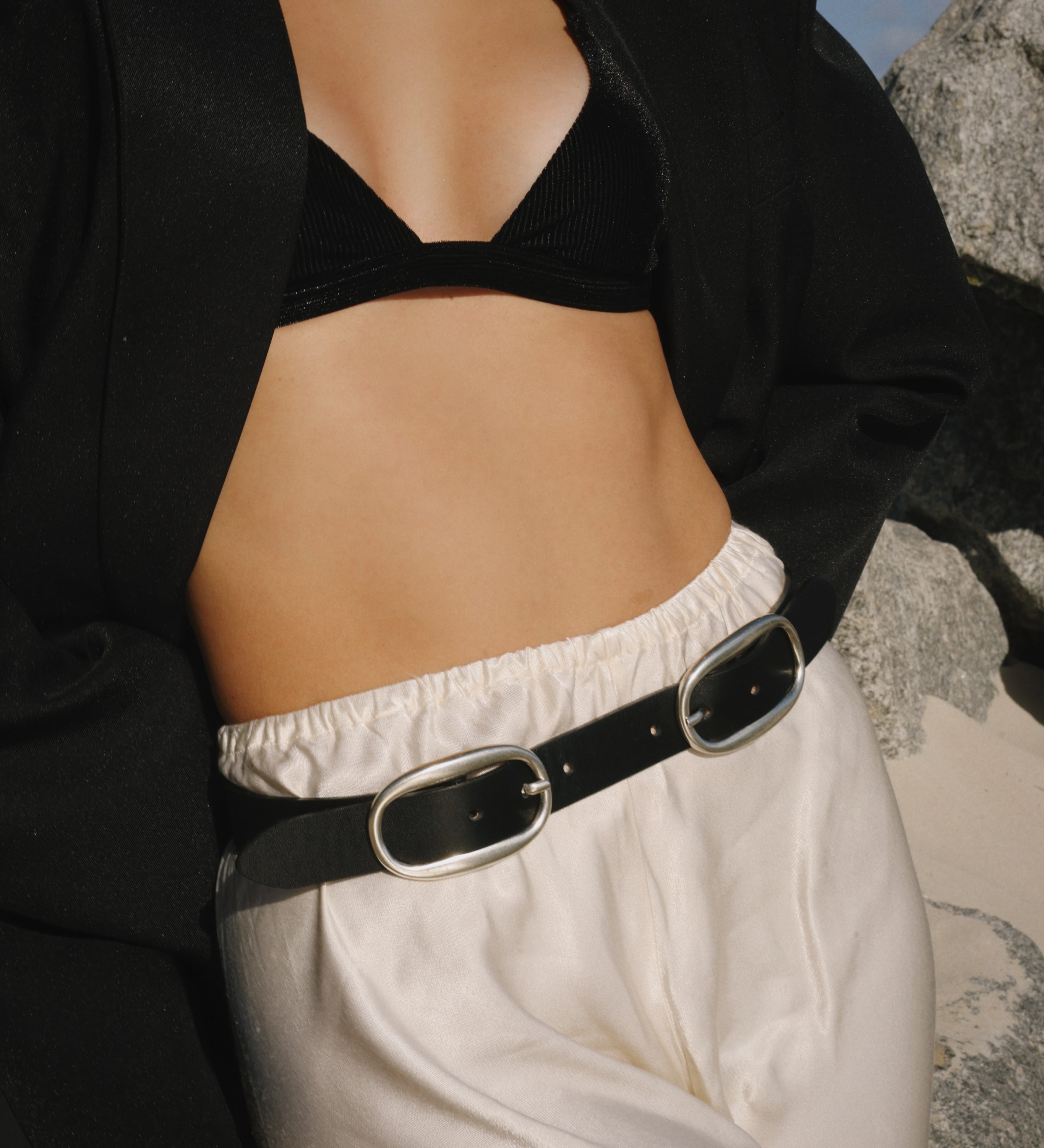 Streets Ahead Alessia Belt — dual oval buckle detail on smooth black leather