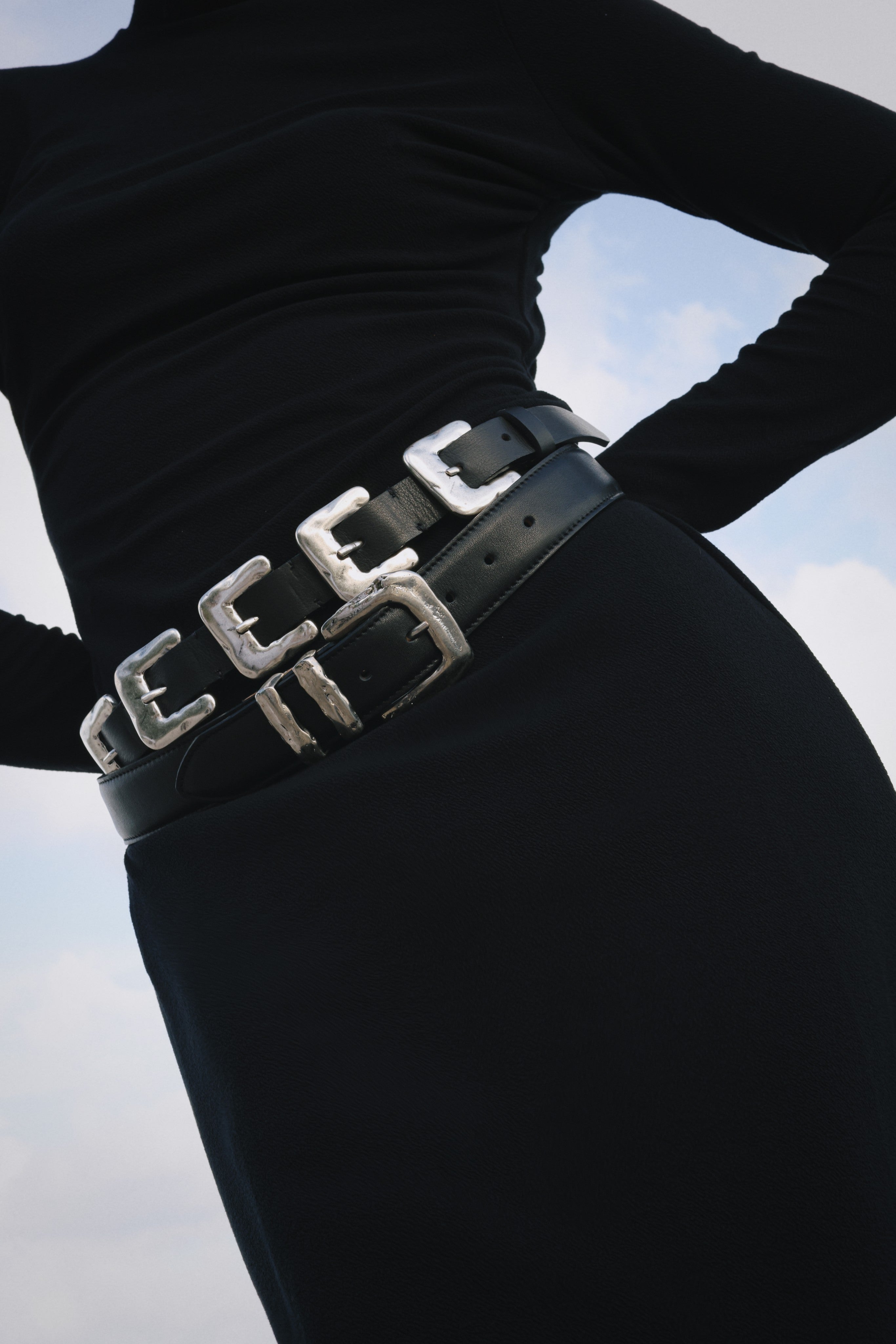 Black Italian leather belt with sculptural silver-plated multi-buckle detailing, handcrafted in Los Angeles using custom hardware