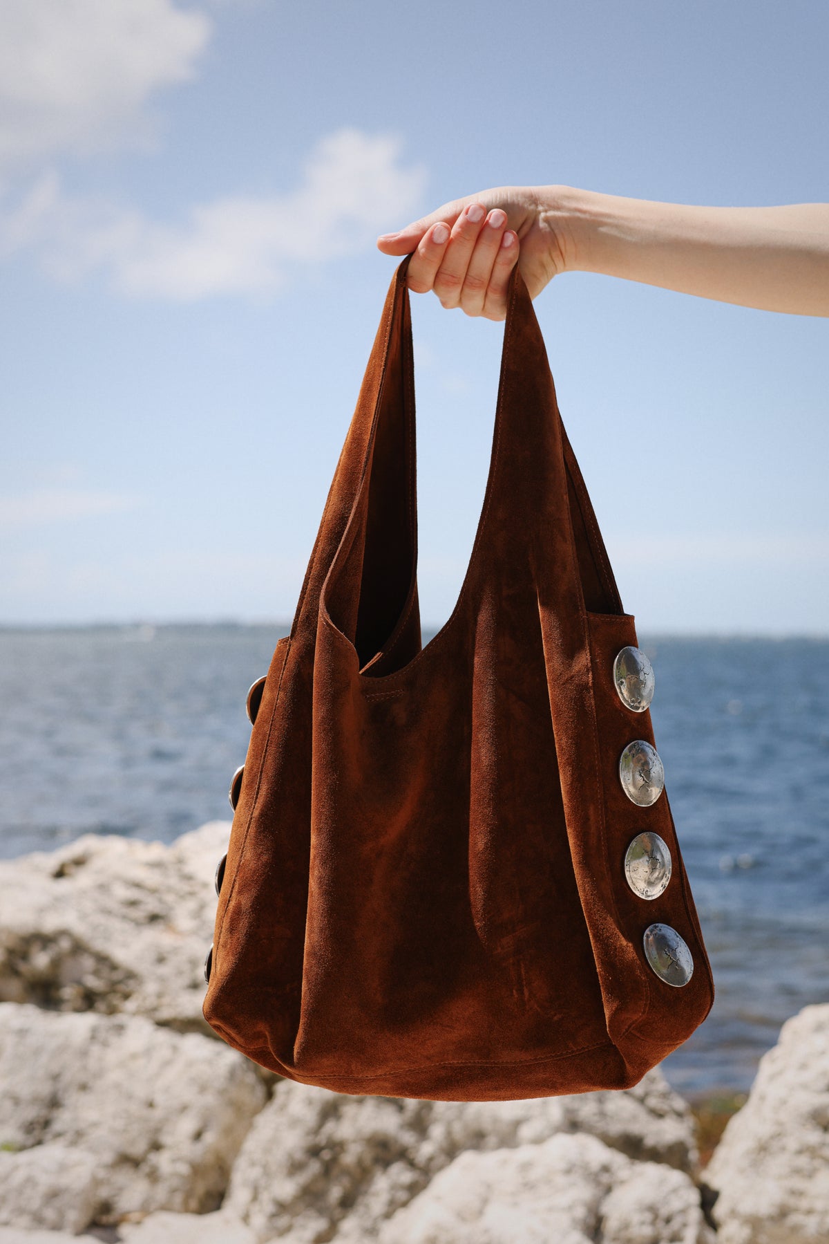 By the water.