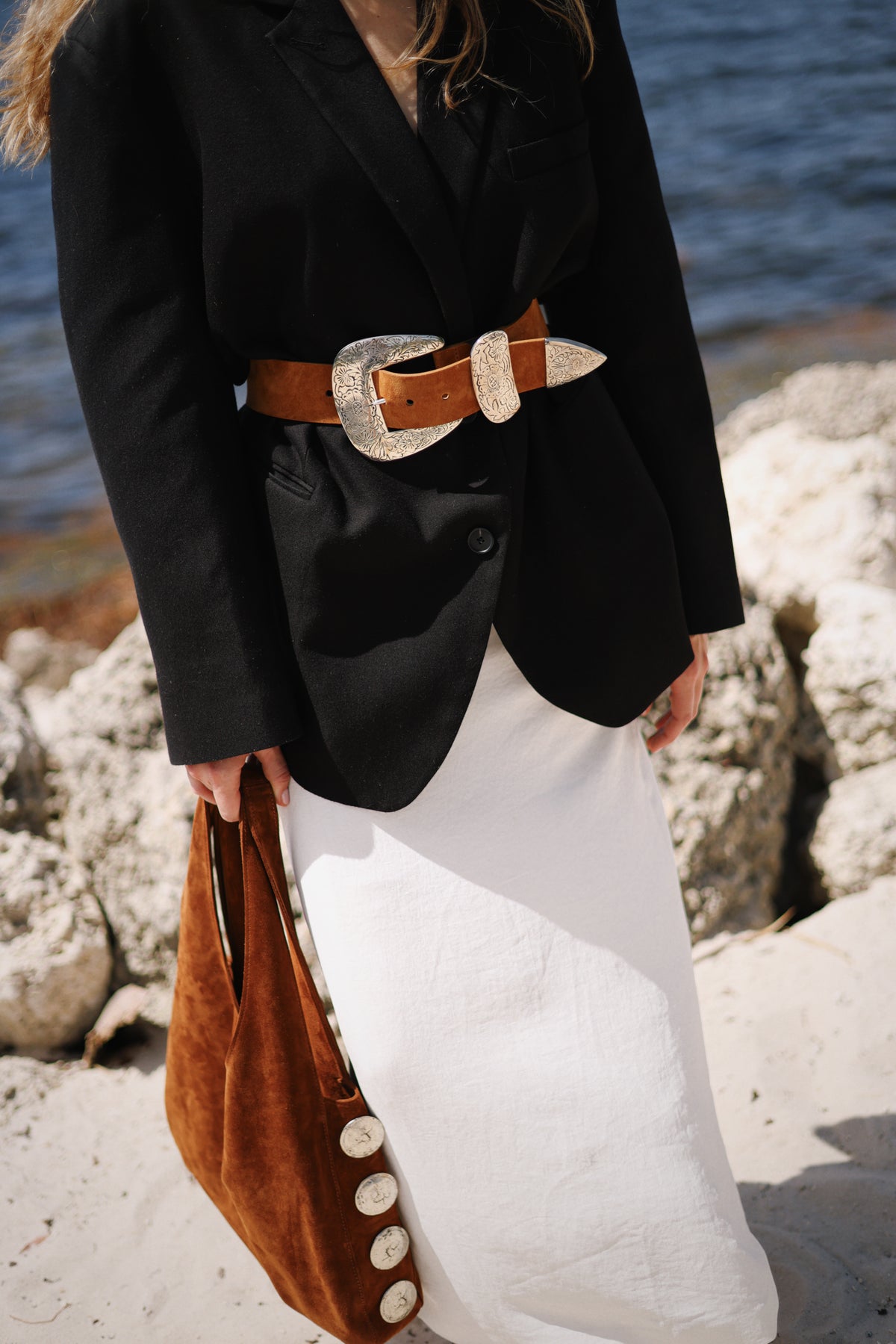By the water.