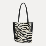 Mini Mara shopper in black and white zebra calf hair with matching zip pouch