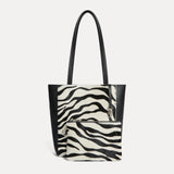 Mini Mara shopper in black and white zebra calf hair with matching zip pouch