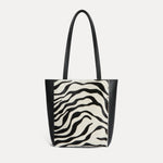 Mini Mara shopper in black and white zebra calf hair with matching zip pouch
