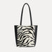 Mini Mara shopper in black and white zebra calf hair with matching zip pouch
