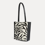 Mini Mara shopper in black and white zebra calf hair with matching zip pouch